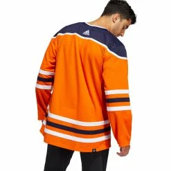 EDMONTON OILERS ADIDAS ADIZERO PRIMEGREEN AUTHENTIC ORANGE HOME JERSEY -Atlantic Division Shop EDMONTON OILERS ADIDAS ADIZERO PRIMEGREEN AUTHENTIC ORANGE HOME JERSEY MODEL BACK